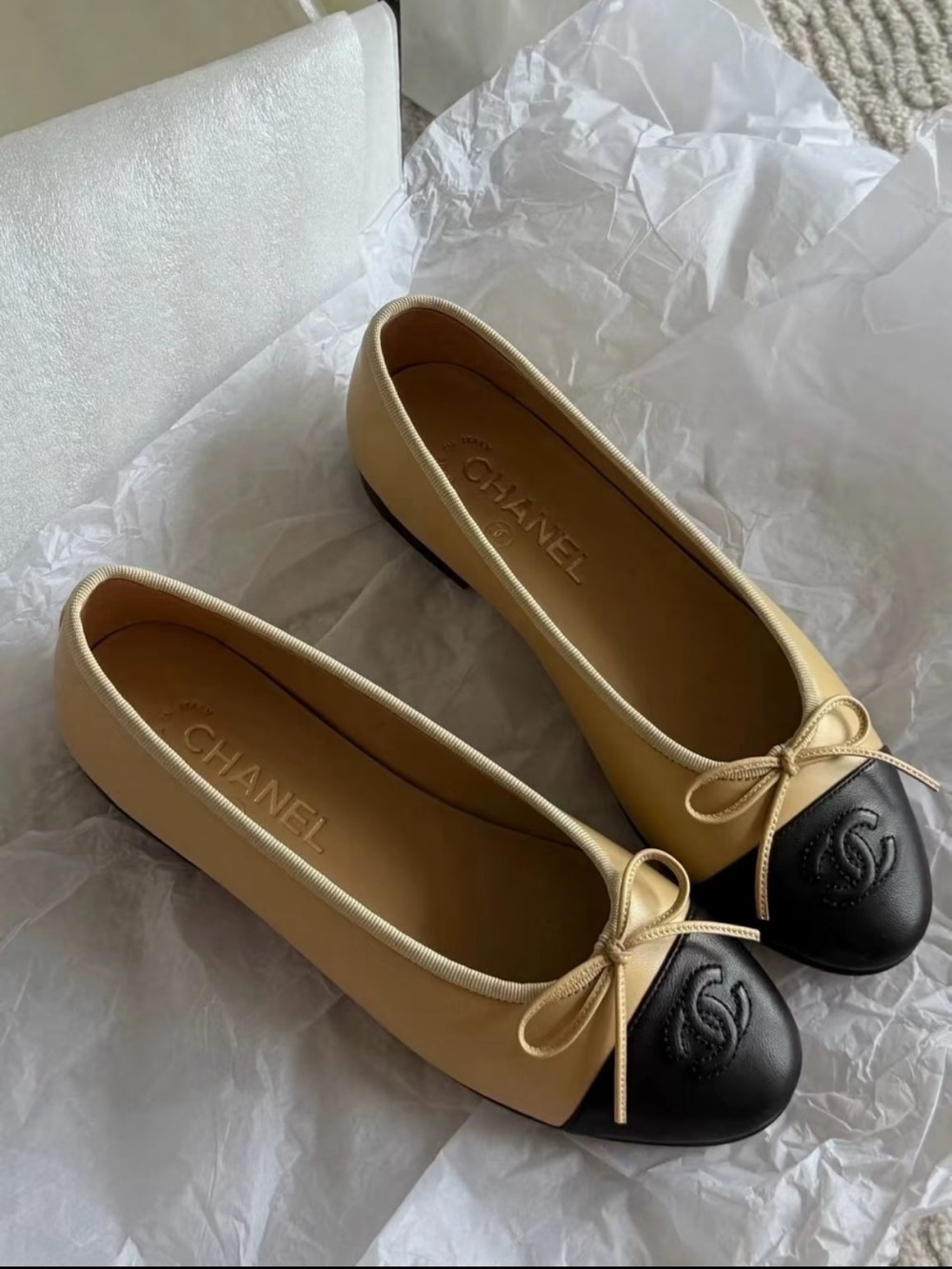 CHANEL Two-Tone Cream and Black Cap-Toe Ballet Flats
